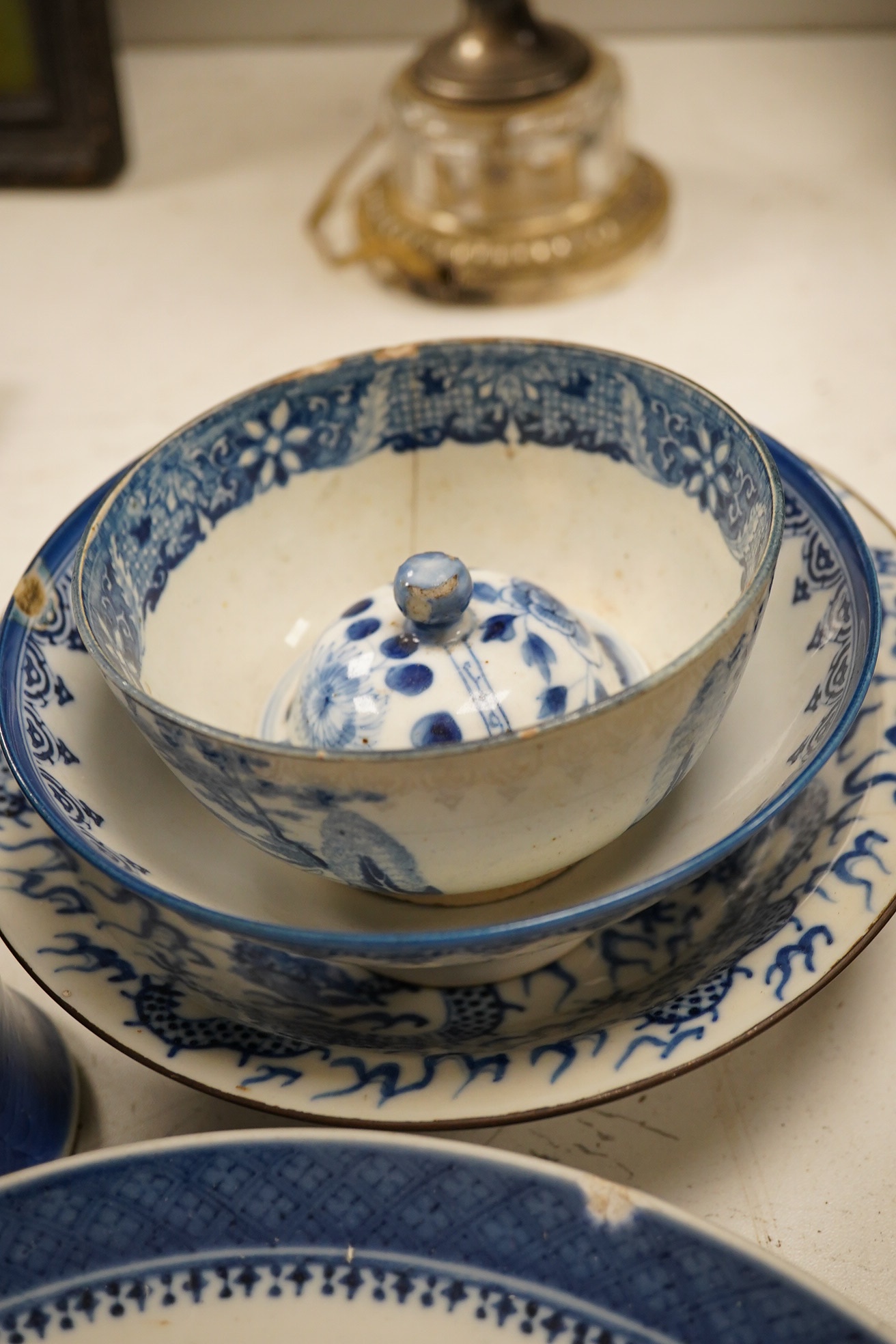 A group of assorted Chinese blue and white tableware. Largest 25cm. Condition - poor to fair